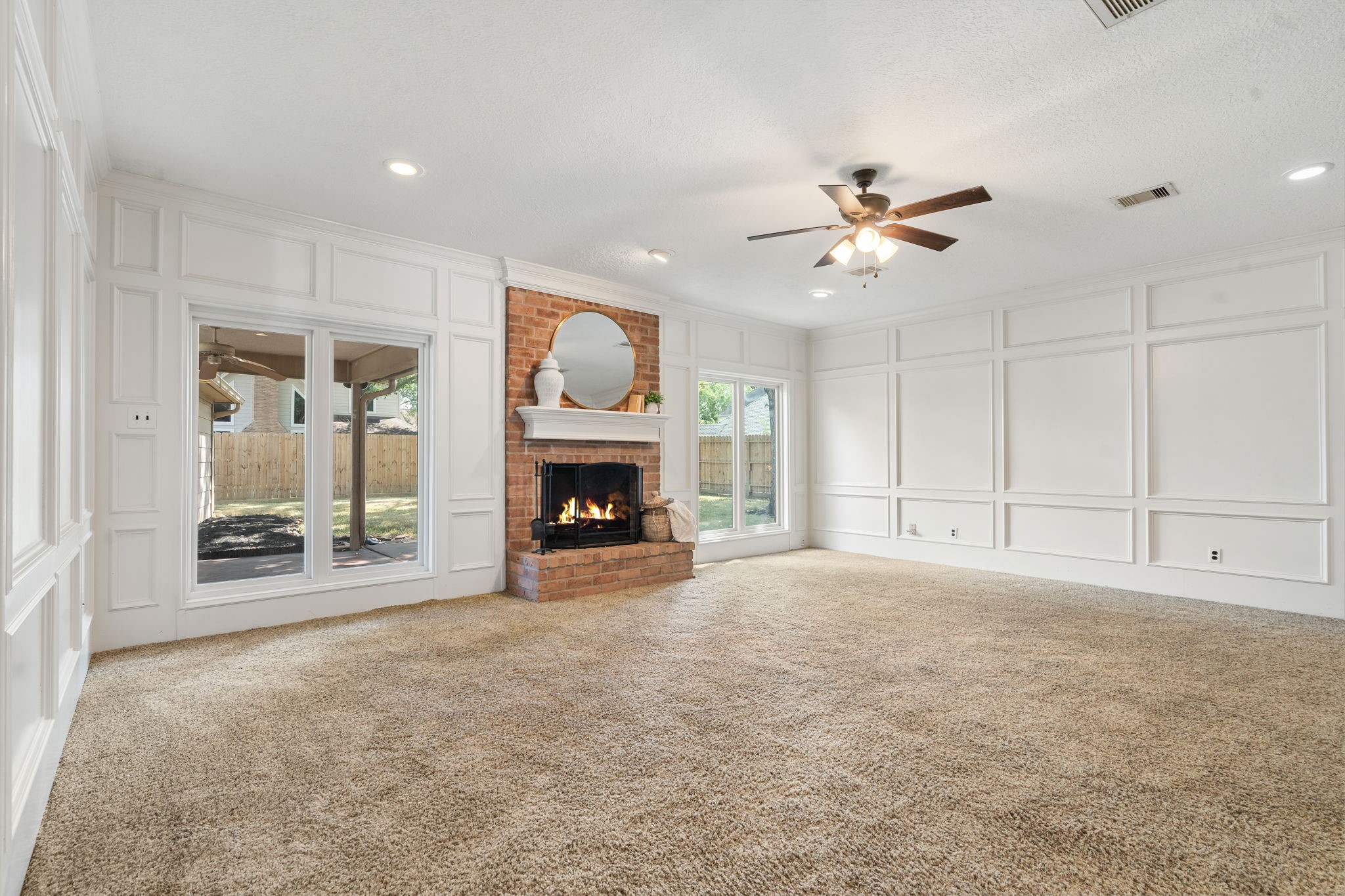 6403 Willow Pine Drive Spring, TX 77379 - Photo 7 of 40 he perfect space for entertaining! This spacious living area is highlighted by a brick dry bar and custom built-in shelving—ready for your next gathering.