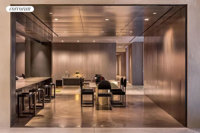 a lobby with furniture and wooden floor