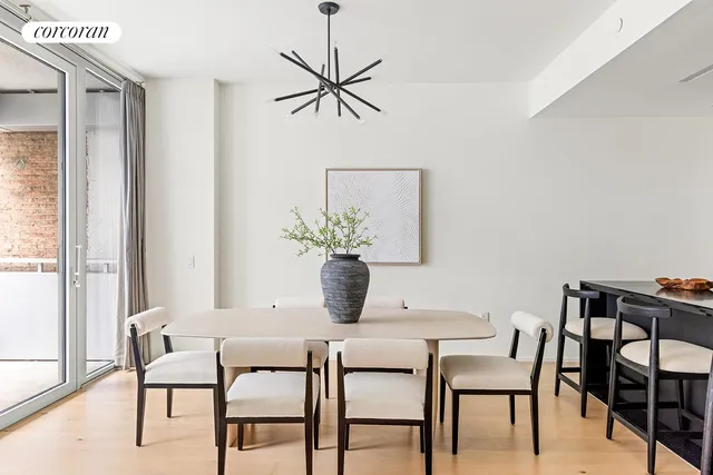a living room with furniture a fireplace and a table