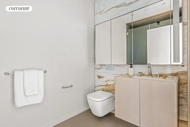 a bedroom with two beds and a window