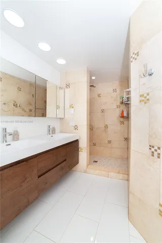 a bedroom with a bed window and couch