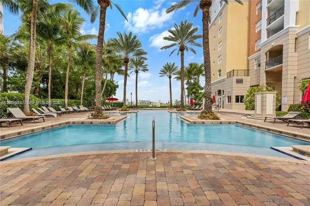 a view of a brick building next to a yard