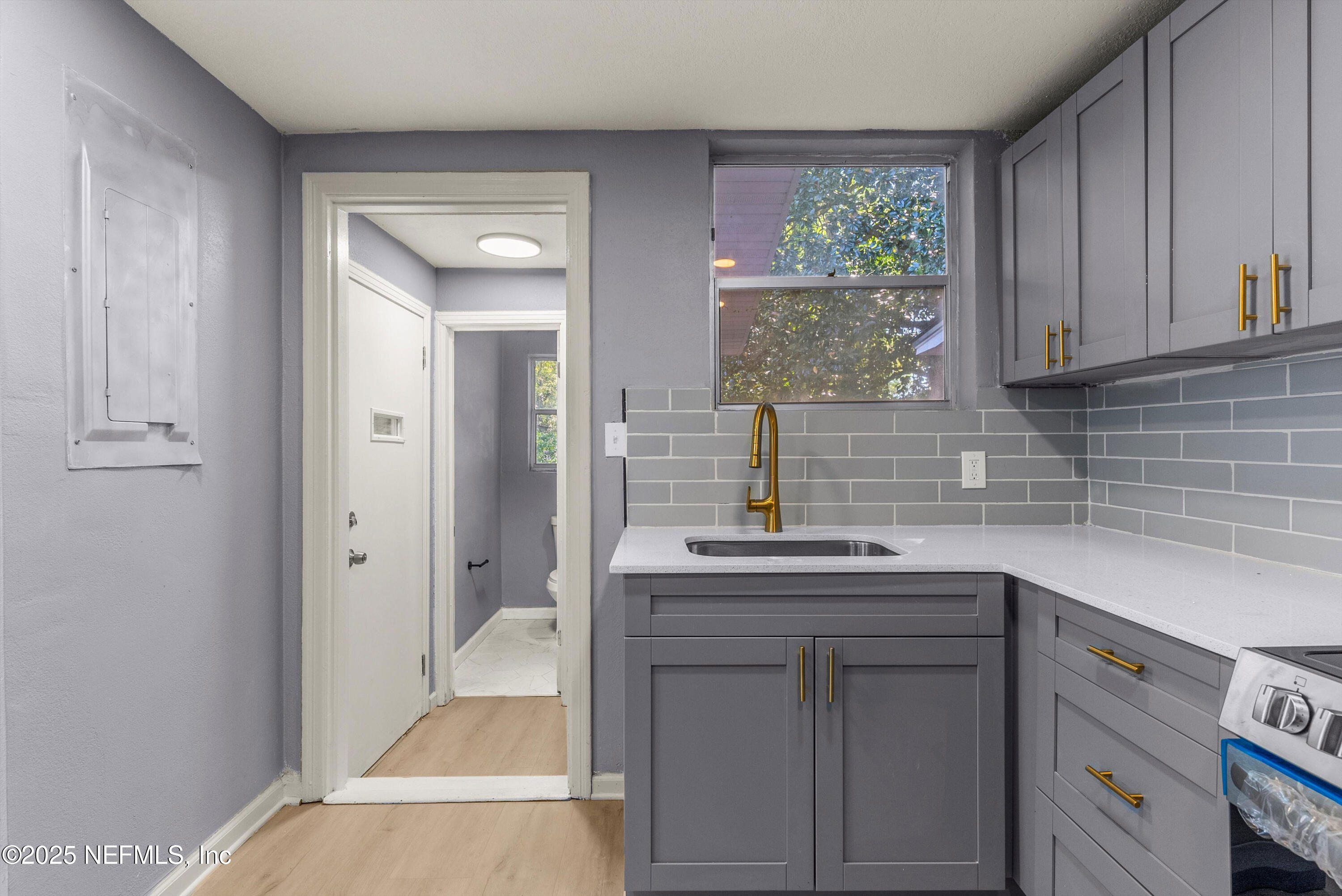 3150 Belden Circle Jacksonville, FL 32207 - Photo 17 of 69 a kitchen with a sink and cabinets