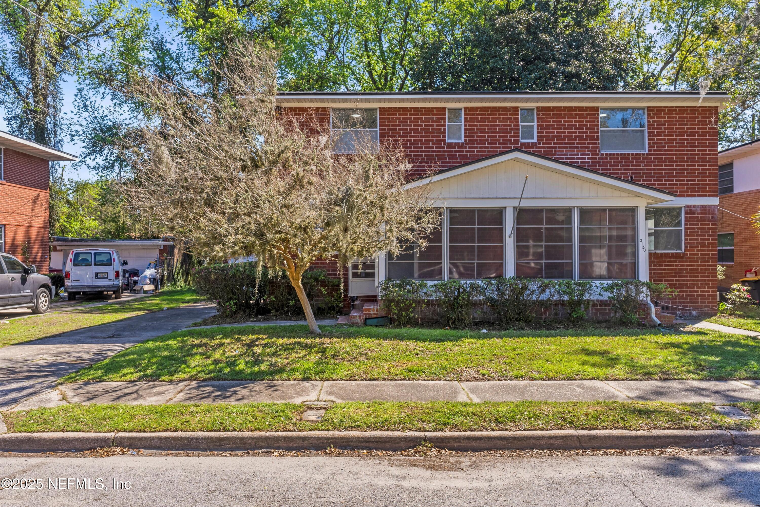 3150 Belden Circle Jacksonville, FL 32207 - Photo 3 of 69 a front view of a house with a yard