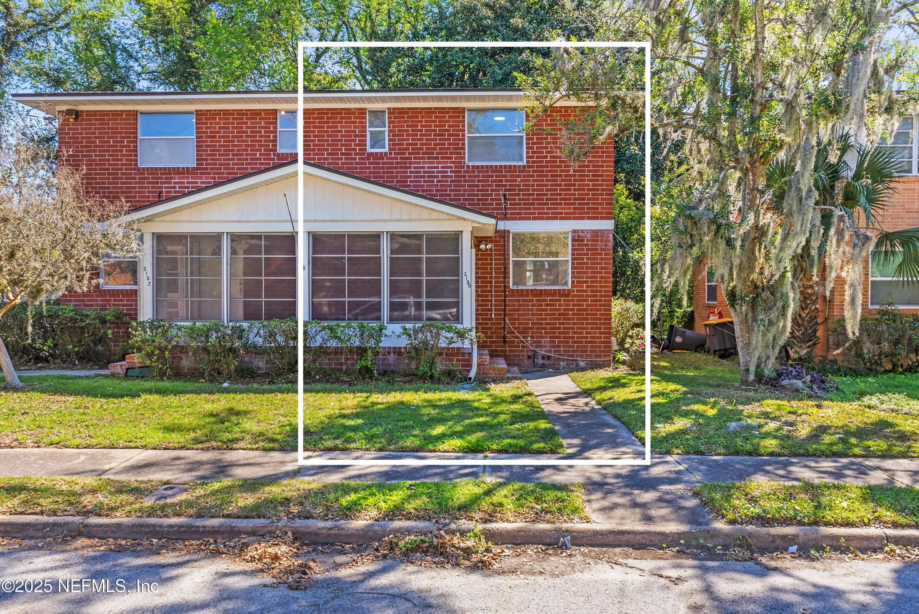 3150 Belden Circle Jacksonville, FL 32207 - Photo 36 of 69 a front view of a house with garden