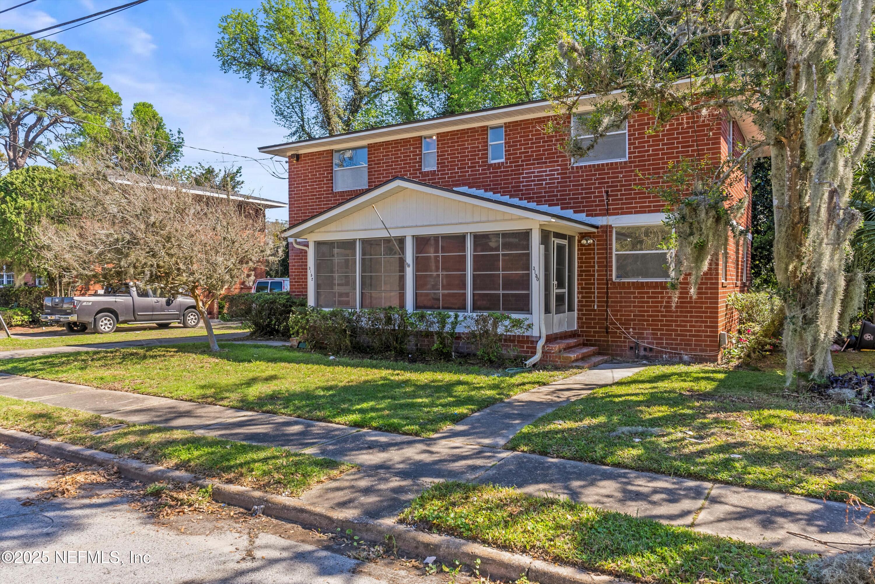 3150 Belden Circle Jacksonville, FL 32207 - Photo 38 of 69 a front view of a house with a yard