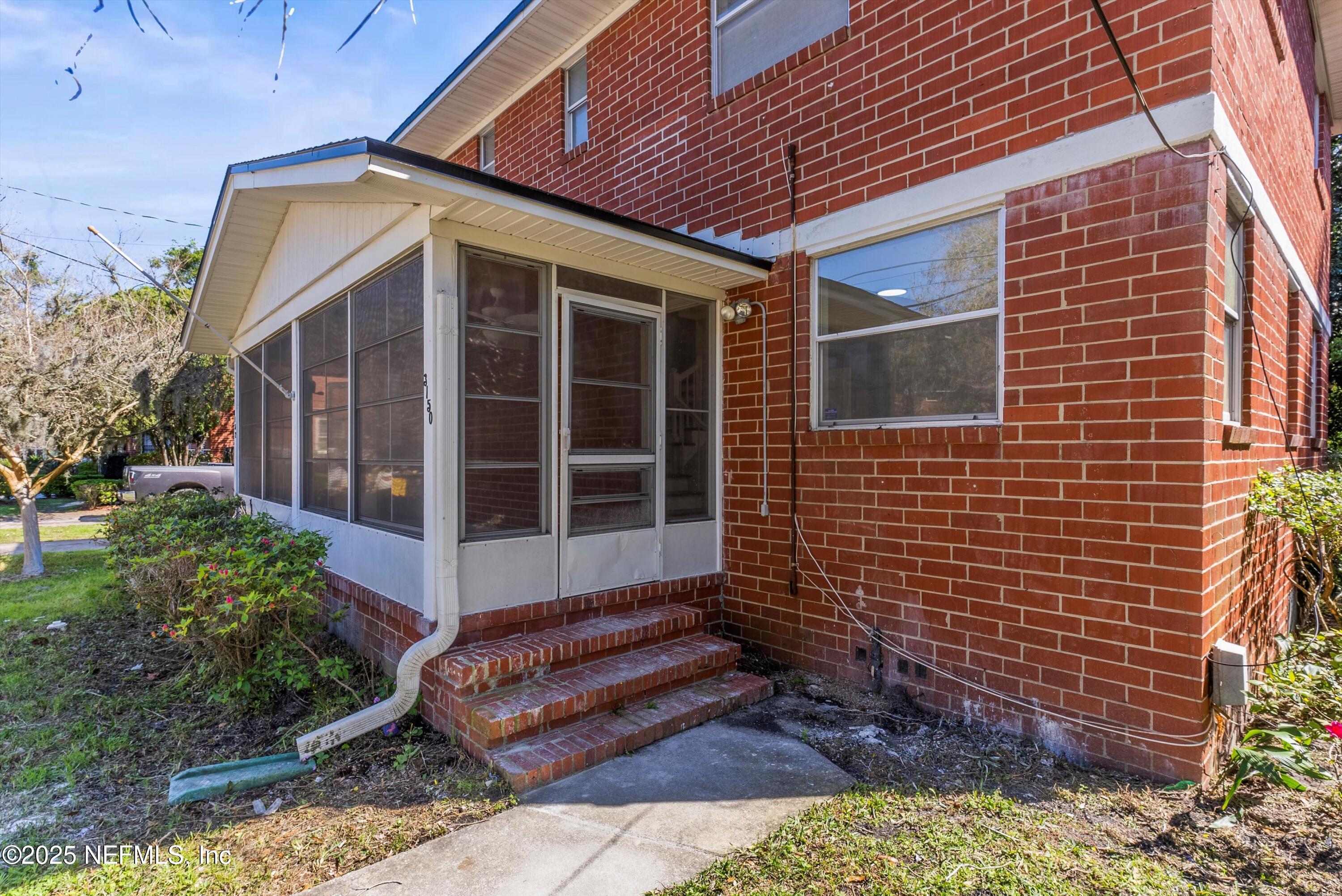 3150 Belden Circle Jacksonville, FL 32207 - Photo 39 of 69 a front view of a house with a garden