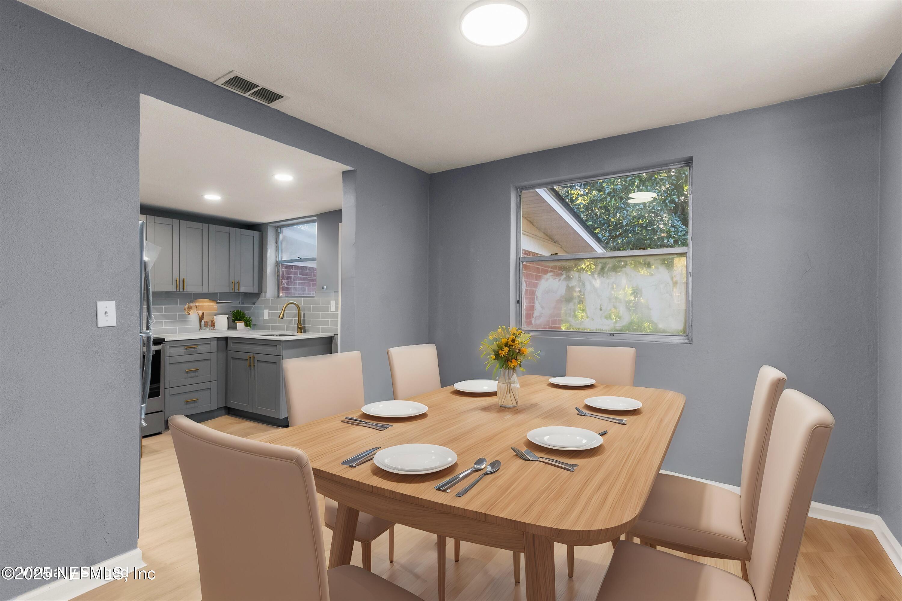 3150 Belden Circle Jacksonville, FL 32207 - Photo 44 of 69 a view of a dining room with furniture and a window