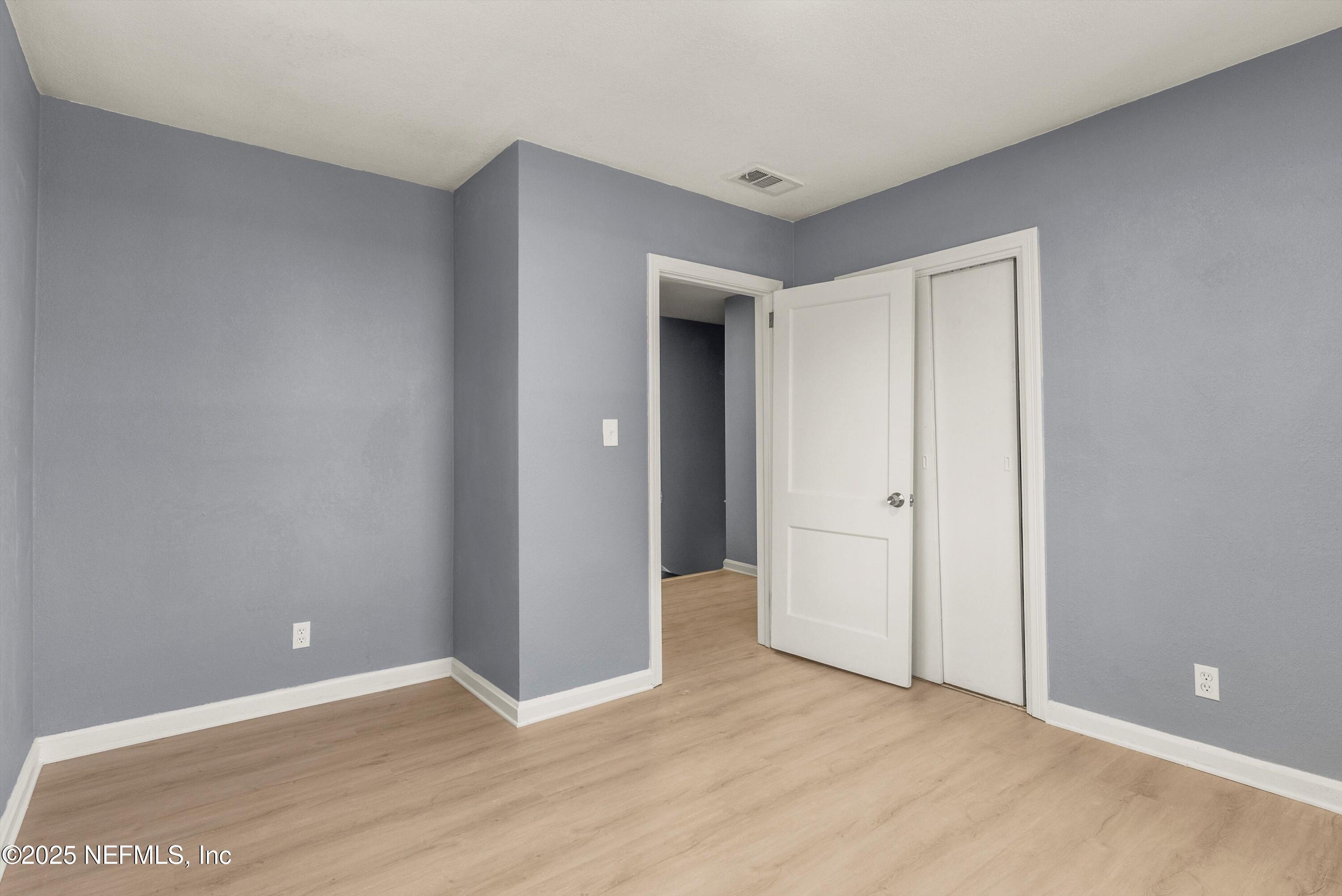 3150 Belden Circle Jacksonville, FL 32207 - Photo 61 of 69 a view of an empty room with wooden floor