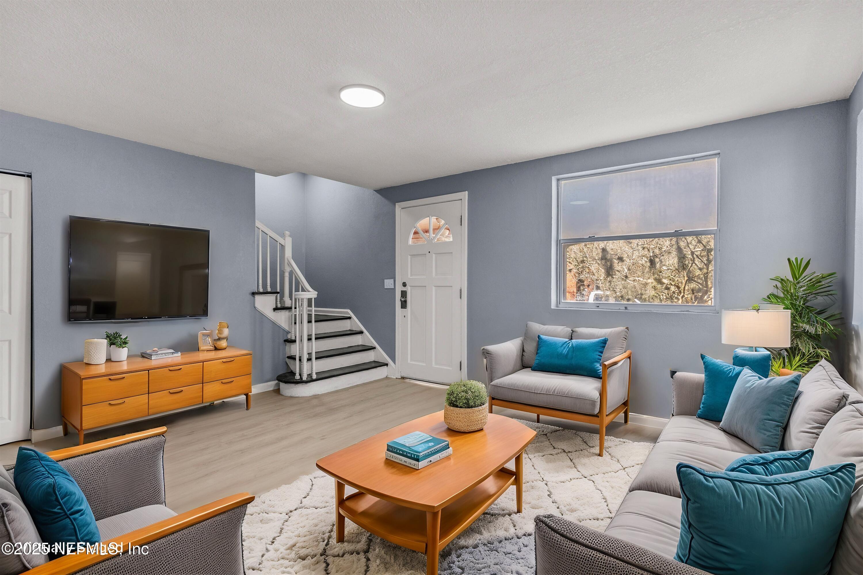 3150 Belden Circle Jacksonville, FL 32207 - Photo 9 of 69 a living room with furniture and a flat screen tv