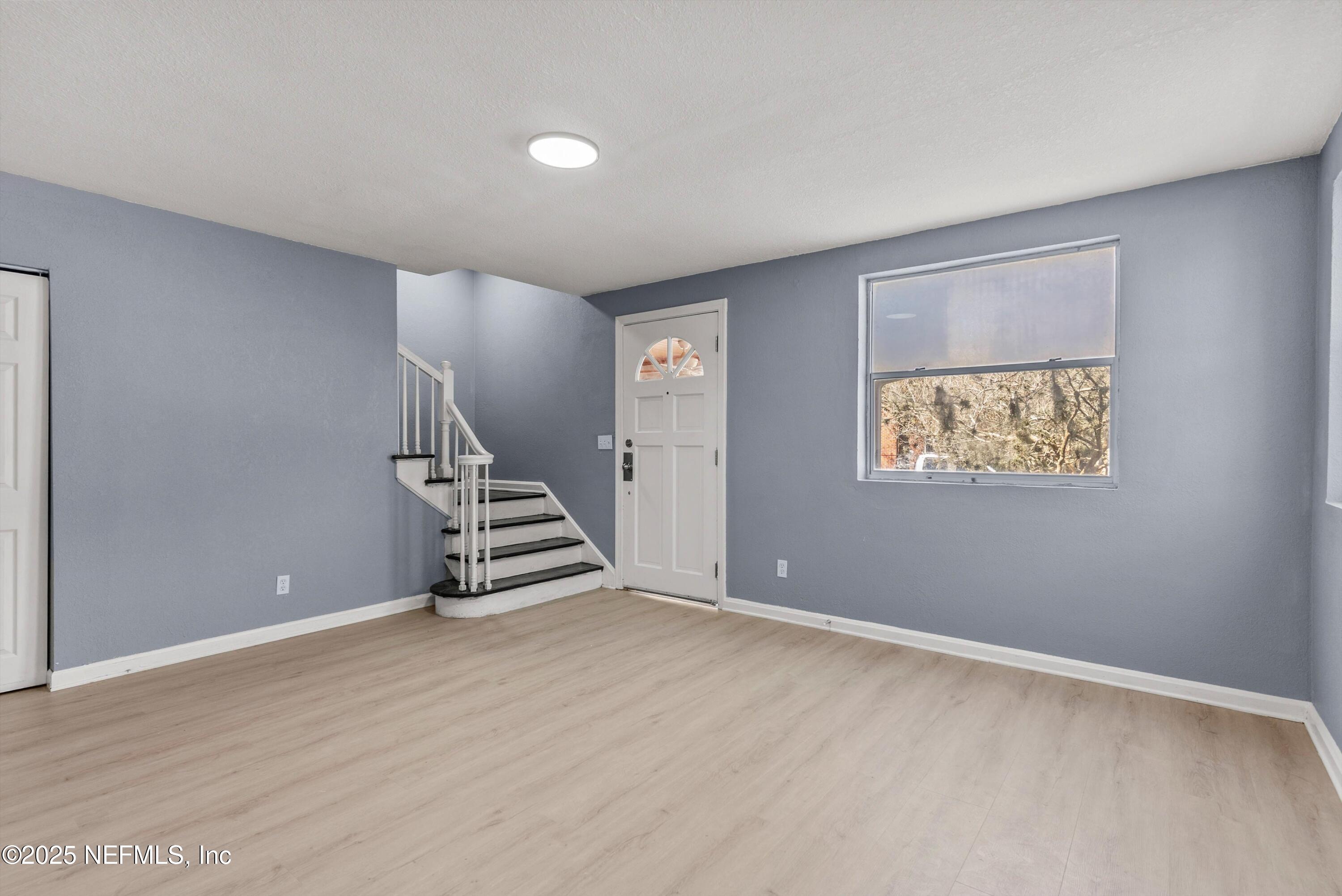 3150 Belden Circle Jacksonville, FL 32207 - Photo 10 of 69 an empty room with windows