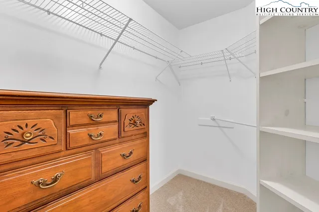 a view of a storage and utility room with racks on the wall