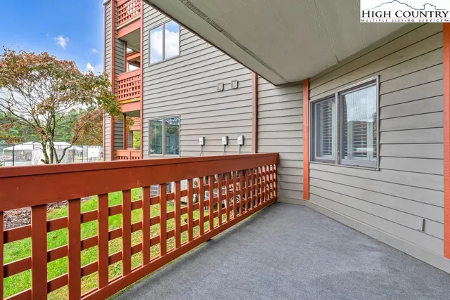 a view of a porch with a small yard