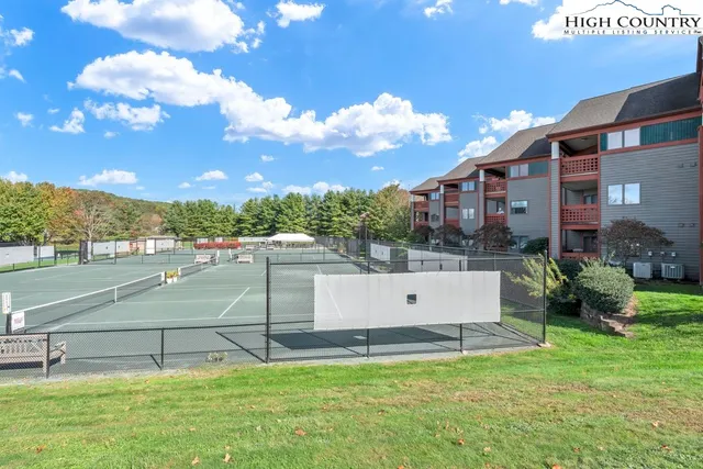 a view of a swimming pool with a yard