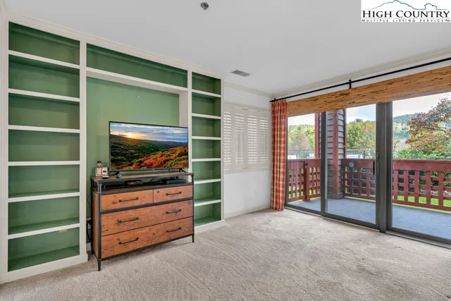 a room with furniture and a flat tv screen