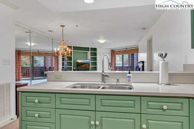 a kitchen with sink and window
