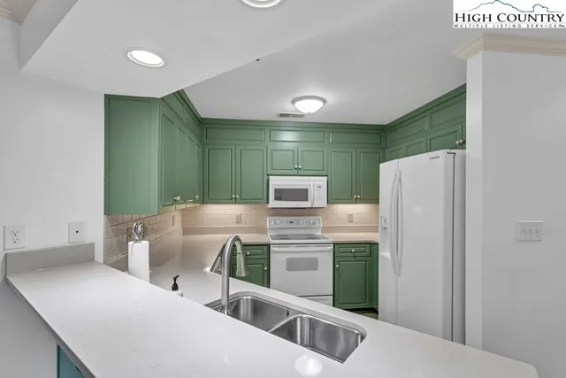 a kitchen with stainless steel appliances refrigerator and stove