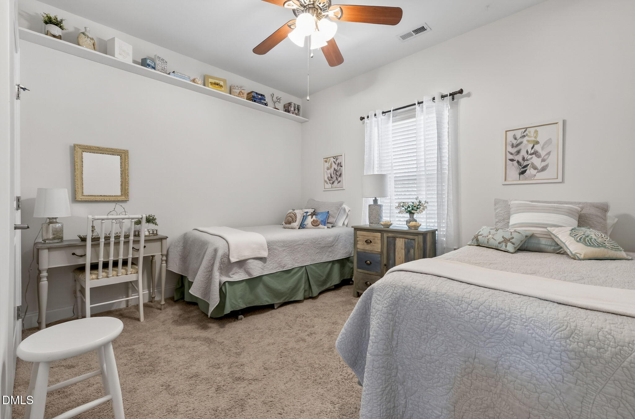 20 Deep Clay Circle Angier, NC 27501 - Photo 39 of 54 a bedroom with a bed and a chandelier