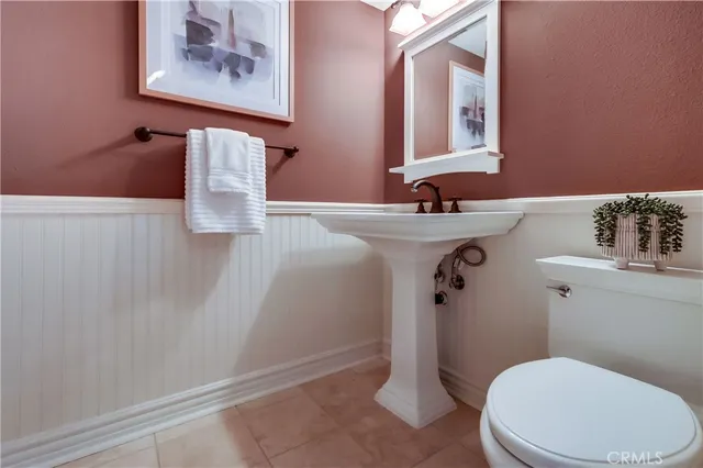 a bedroom with a bed and a fireplace