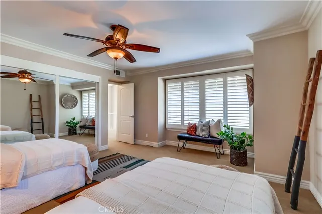 a bathroom with a granite countertop sink a bathtub and a window