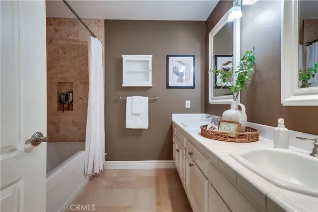 a living room with furniture and view of kitchen