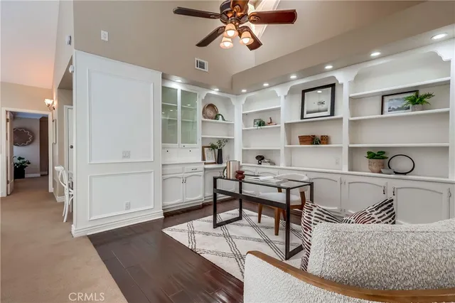a living room with a bed furniture and a window