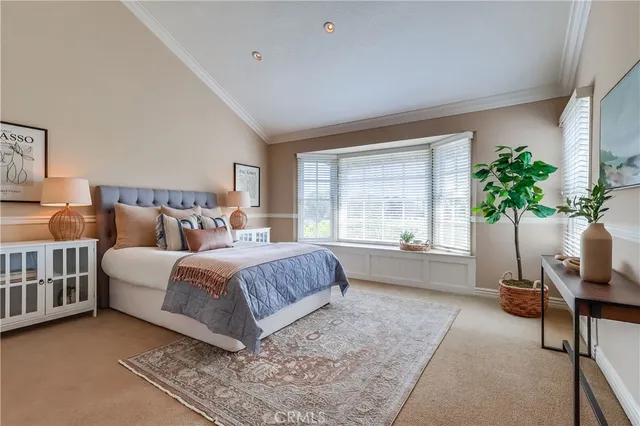 a bedroom with a bed and dresser