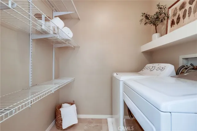 a view of swimming pool with outdoor seating and plants