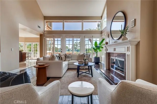 a living room with furniture a window and a fireplace