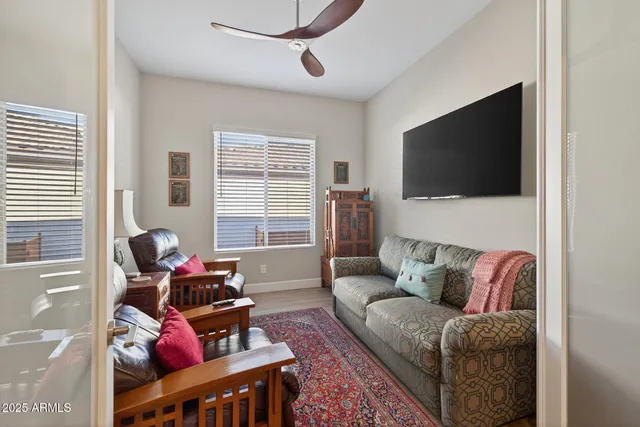 a living room with furniture and a rug