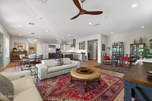 a kitchen with stainless steel appliances a sink stove and cabinets