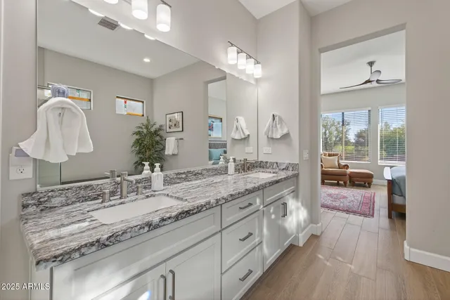 an aerial view of residential houses with a city view