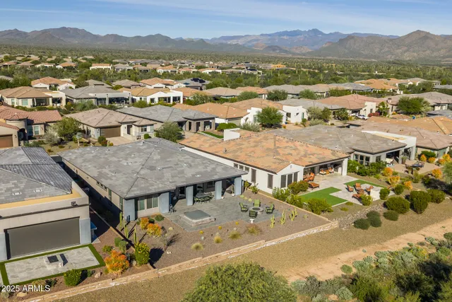 an aerial view of a house with outdoor space