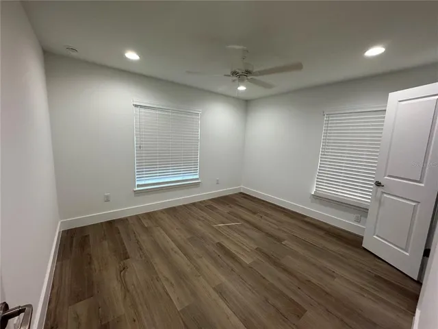 a bathroom with a double vanity sink and mirror