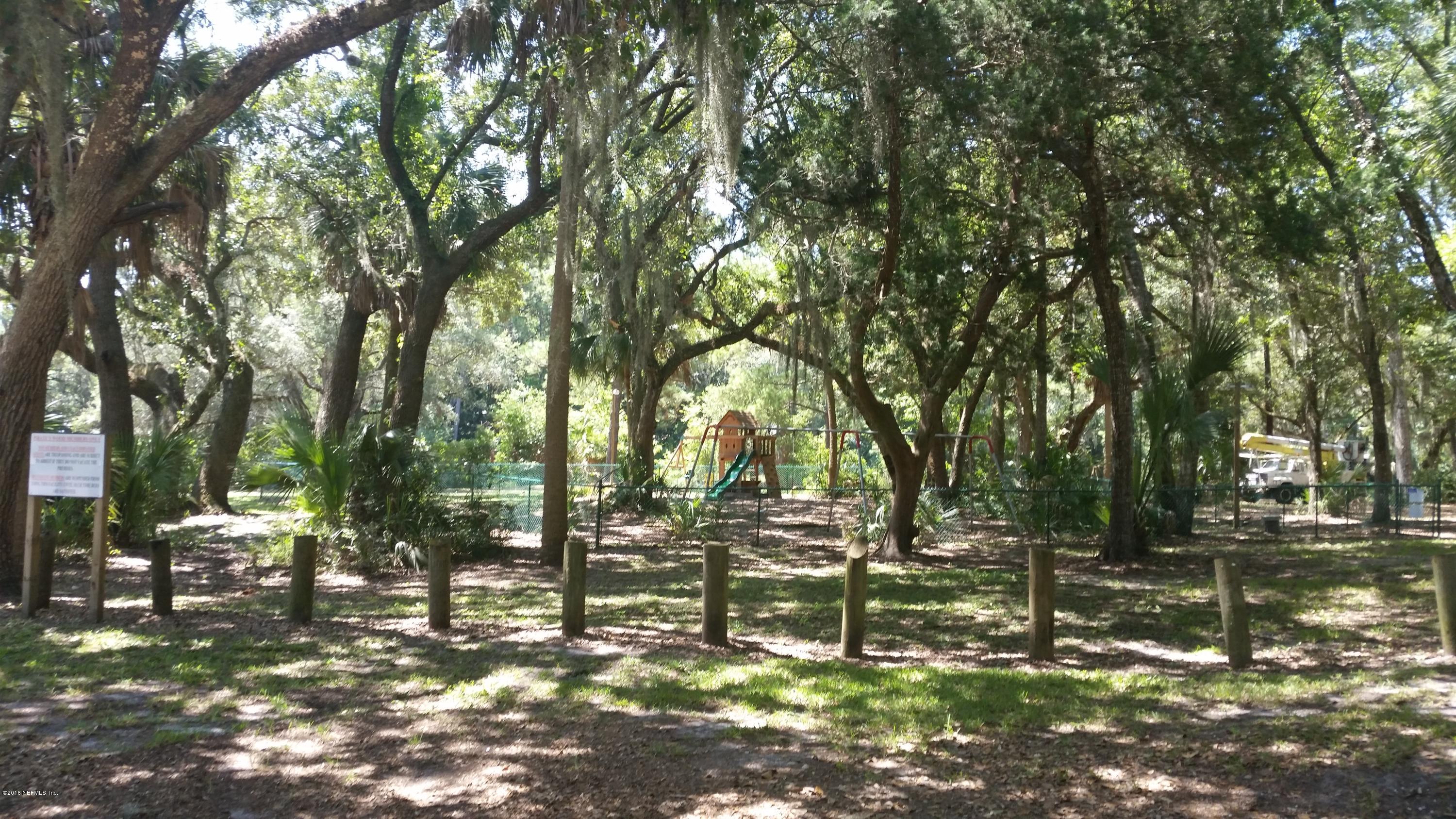 Lot 28 Pirates Point Road Yulee, FL 32097 - Photo 8 of 13 a view of outdoor space with lots of trees