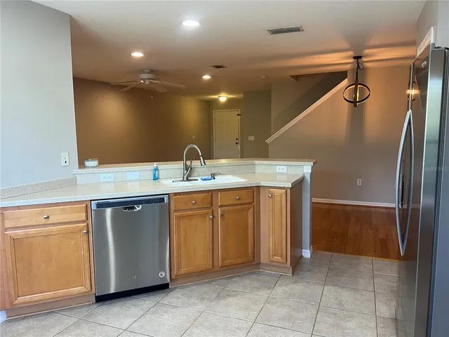 a kitchen with a sink a refrigerator and a sink