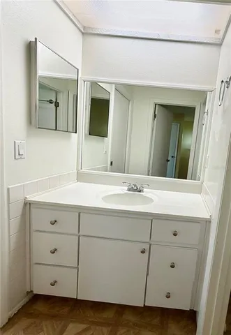 a bathroom with a double vanity sink and mirror