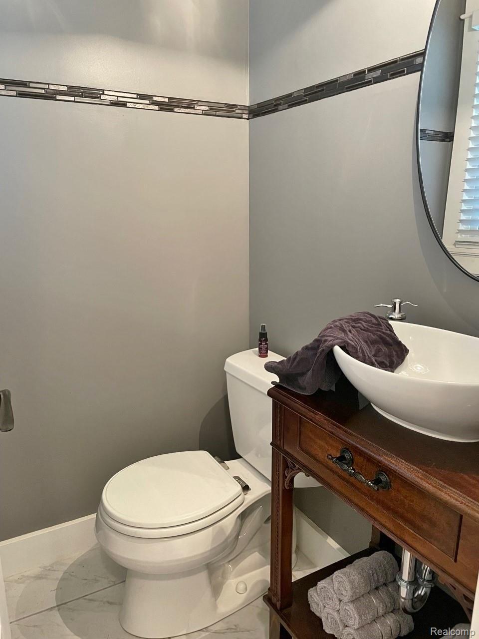 929 Main Street Fenton, MI 48430 - Photo 25 of 28 Updated ceramic half bath