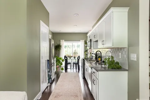 a view of a kitchen from the hallway