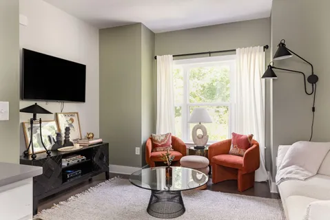 a living room with furniture and a flat screen tv