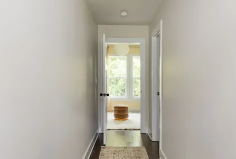 a view of a hallway with a window