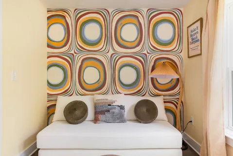 a bedroom with bed and a window