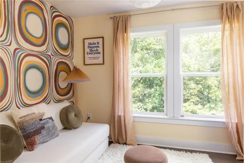 a view of a hallway with a painting on the wall