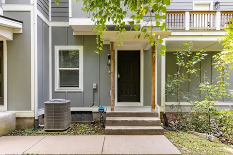 a view of a building with a yard