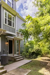 a view of a brick house with a yard