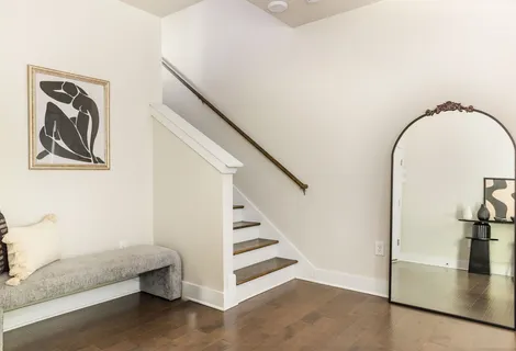 a view of an entryway with wooden floor