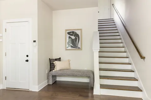 a view of a hallway with staircase