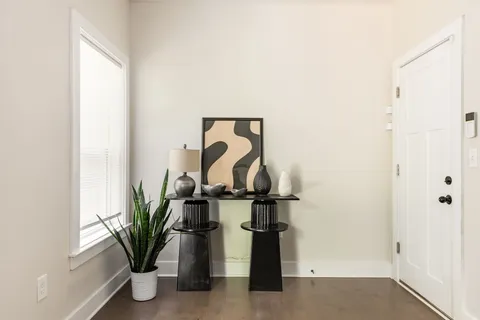 a vase of flowers sitting on a floor