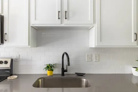 a bathroom with a sink and a window