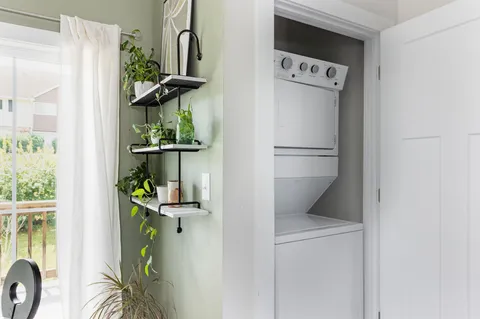 a kitchen with a refrigerator and a window